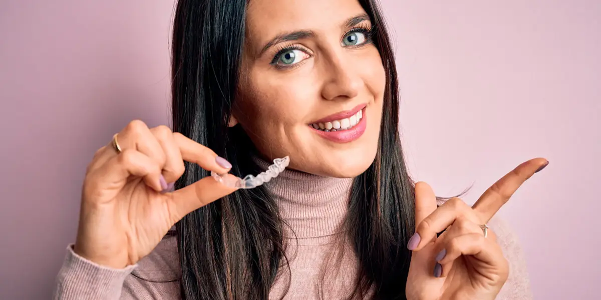 Patient smiling after Invisalign treatment