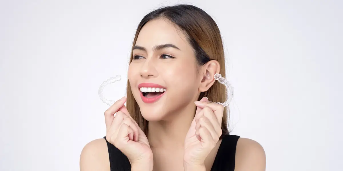 Invisalign aligners being fitted